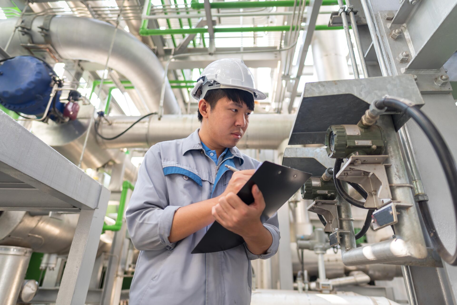 Engineer working and check valve at thermal power plant factory